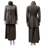 A 1910s walking suit in olive green wool with cotton lining. the jacket has a high neck with