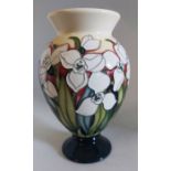 A boxed trial, polar bear snow drops vase by Moorcroft Decorated with white snow drops on a cream