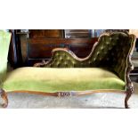 A Victorian mahogany chaise lounge, circa 1860, foliage carving throughout with a later stuffed