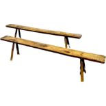 A near pair of oak/elm rustic benches, single plank raised on splay supports. 50cm H x 226cm W x