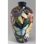 A boxed Kaleidoscope vase, made by Moorcroft Decorated with butterflies, fruits and flowers, with