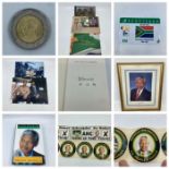A selection of genuine Nelson Mandella memorabillia, including a signed photograph and Book,