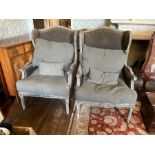 A pair of wingback armchairs, Victorian style, upholstered seat, raised on reeded supports. (2)