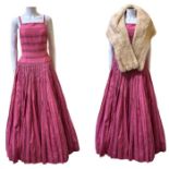 A 1950s mink stole and a 1950s Jean Allen evening gown in a pink rayon silk with jacquard pattern