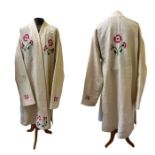 A vintage cream wool ethnic robe from robe with embroidered and quilted detail, used in the Mikado