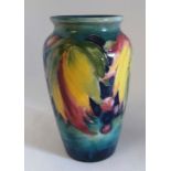 A William Moorcroft " Leaf and Berry " pattern shouldered vase Signed WM in blue to base Potters