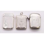 A collection of three sterling silver vestas. Featuring an unengraved vesta marked for Birmingham