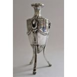 An Edwardian silver Neo-Classical vase of urn form with wrythen neck and cast with rams heads and