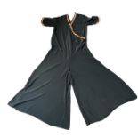 A pair of 1920s beach pyjamas, all in one style in black rayon with a striped boarder in red and