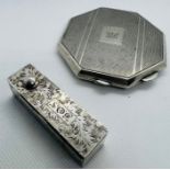 A sterling silver Octagonal mirrored compact, with engine turned pattern and engraved with the