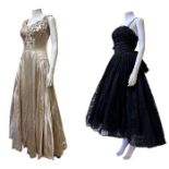 A Dior inspired 1950s evening gown in a black flocked voile with a rouched, deep cummerbund style