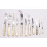 A collection of mother of pearl and silver tableware and other items. Featuring a sterling silver