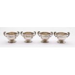 Two pairs of Edward VII matched sterling silver two handled egg cups. One pair marked for George