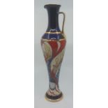 A boxed, fish jug with gilding by Moorcroft, stands 30cm high. Condition: Good, no chips cracks or