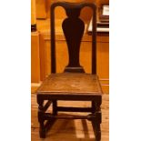A George I revival oak chair, pierced splat back, raised on baluster on block supports. 92cm H