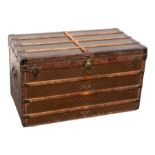 Louis Vuitton - A vintage early 20th Century trunk with leathered "LV" design to all sides, the