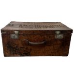 An early 20th century crocodile skin travel trunk with calf leather lining and locking clasps with