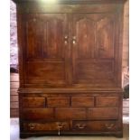 A George III oak housekeepers provision or livery press cupboard, circa 1800, moulded cornice