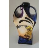 A boxed Songbird pattern Moorcroft vase , of square shape with twin handles . nicely decorated