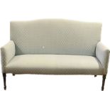 A 20th Century two seater sofa, cartouche shaped back, curved armrests, raised on tapering supports.