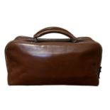 A rare mid century vintage Hermes travel bag in a mid tone brown leather with two top handles and