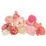 Another large collection of eclectic hats, to include: a pink straw beret; a pink chiffon picture