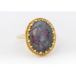 A 9ct gold opal triplet set ring, comprising an oval opal triplet, approx 13 x 9mm claw set within a