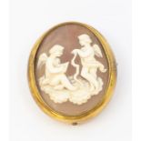 A 19th century shell cameo brooch depicting cupid, gilt setting with picture locket reverso  inset