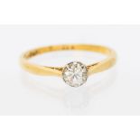 A diamond and 18ct gold solitaire ring, comprising a round claw set  brilliant cut diamond,