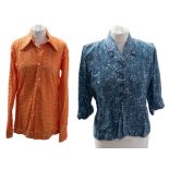 A vibrant orange men's shirt with collar in an elephant ears design. The cotton fabric is in