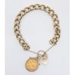 A 9ct gold chain bracelet with a heart padlock incorporating an Edward VII sovereign in a clip