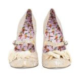 A pair of Irregular Choice courtesan floral bar shoes in off-white suede / gold and metallic