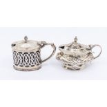 Two early 20th Century mustard pots and covers to include: a Neo-Classical style example, hallmarked