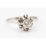 A diamond and white gold ring, comprising a central round brilliant cut diamond, weighing approx 0.