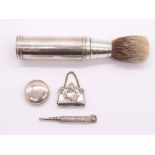 A George V silver mounted shaving brush, cylindrical holder and cover, the cover hallmarked by