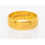 A 22ct gold ring, width approx 7mm, size U, weight approx 8.8gms  Further details: minor wear and