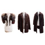 Two fur coats to include: one dark brown with a hint of henna, late 1940s, short to three-quarter