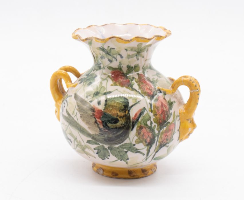 A small, European, tin-glazed, twin-handled vase decorated with birds and foliage. Size 10cm high. - Image 2 of 3