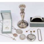 A collection of silver to include: a single modern weighted silver candlestick, Birmingham 2000, a