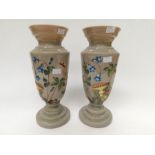 A pair of early 20th Century vaseline glass hand painted vases
