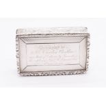 A Victorian silver snuff box, ornate border above sides engraved with scrolling foliage, the cover