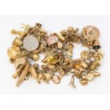 A 9ct gold charm bracelet, comprising various 9ct gold charms, mostly marked 9ct gold, to include