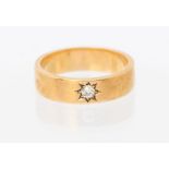 A diamond set rose gold band, star set to the centre with an old cut diamond approx 0.10ct, band