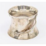 An Art Nouveau silver spool shaped salt with loop and floral motif handles, hallmarked by Henry