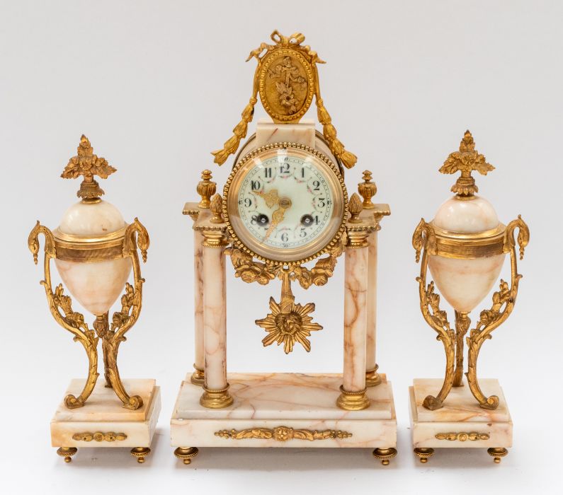 An early to mid 20th century ormolu style clock garniture consisting elaborate brass cased marble