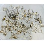 A large collection of sterling silver tableware to include mustard spoons, salt spoons, teaspoons,