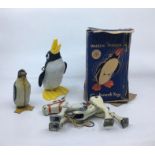 Collection of toys to include Wally The Walking Penguin, and a small tinplate penguin and a