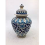 A 20th century Indian Multan pottery jar and cover, height 22cm.