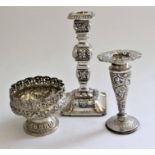 A Victorian silver candlestick partly repousse with foliate scrolls, on square base, Birmingham
