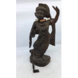 An Indian wooden figure of a deity. H:31cm (a/f)